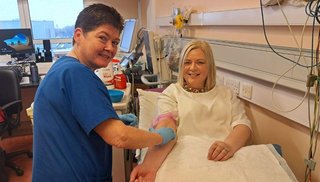 A healthcare worker and a patient in a hospital setting