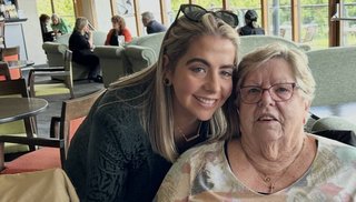 Two women smiling at the camera