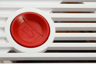 a smoke alarm test button