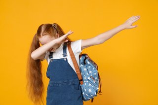 Image showing a girl with her head in her elbow to cover her mouth and nose, and the other arm held out by her side.