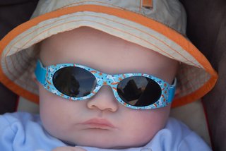 Baby wearing wraparound sunglasses