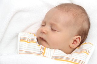 sleeping baby in sleeveless sleeping bag